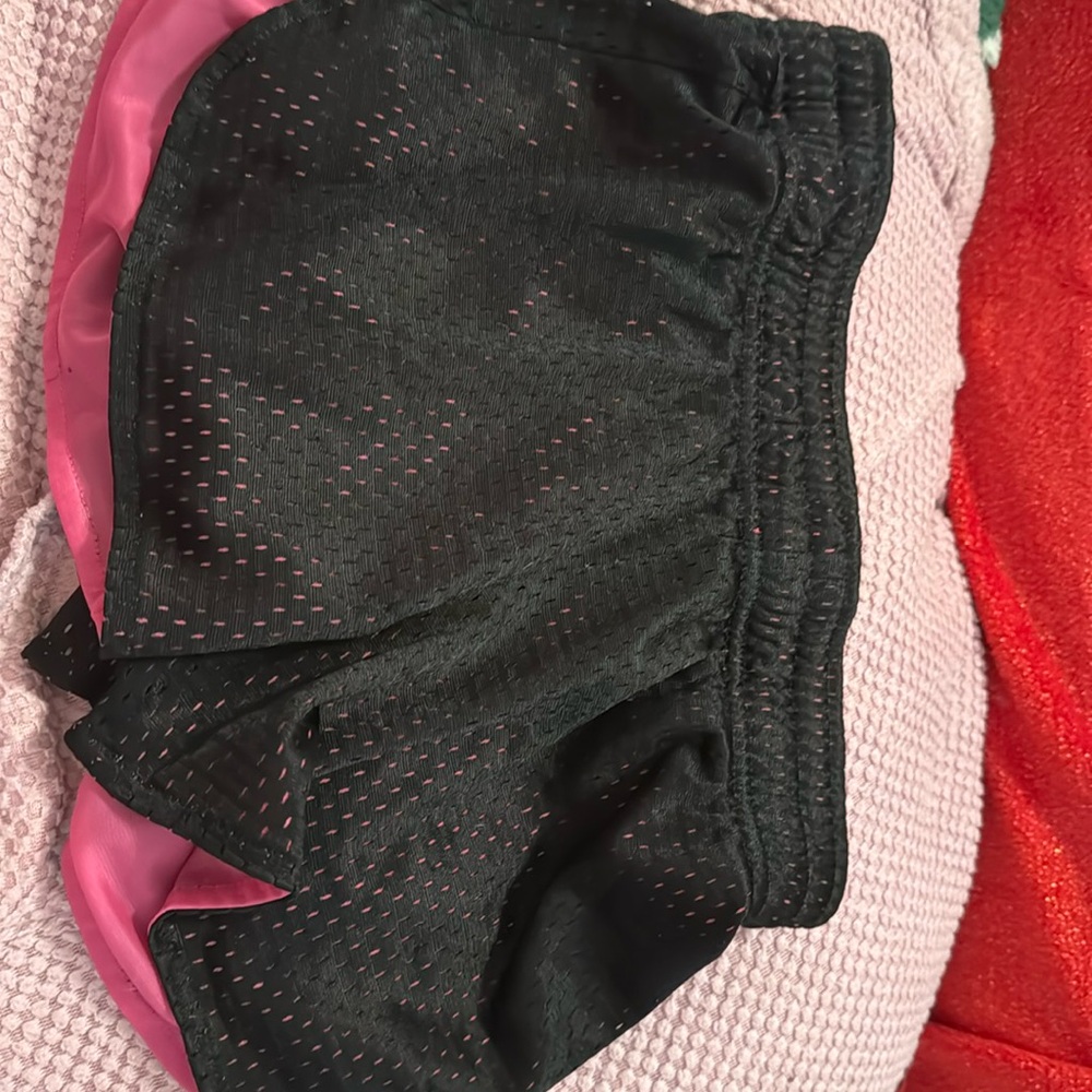 Comfortable shorts with black on the outside and pink on the the inside